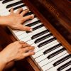 close-up-photo-of-person-playing-piano-1246437
