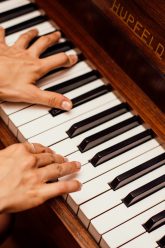 close-up-photo-of-person-playing-piano-1246437