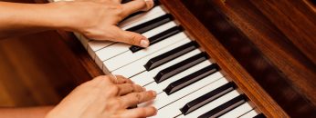 close-up-photo-of-person-playing-piano-1246437
