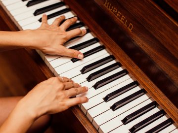close-up-photo-of-person-playing-piano-1246437