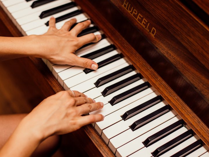 close-up-photo-of-person-playing-piano-1246437
